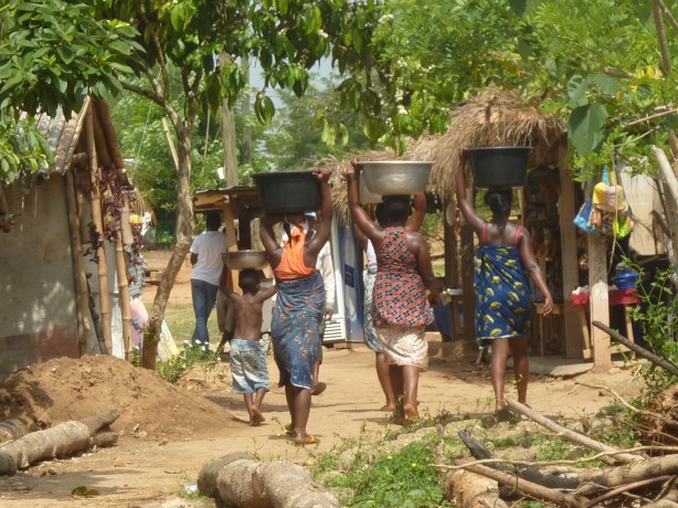 Women fetching water from the river (Wli, Ghana)